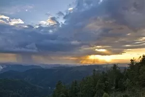Evening rain clouds over the Rhine valley, seen from Mt. Schliffkopf, Black Forest, Baden-Wuerttemberg, Germany, Europe