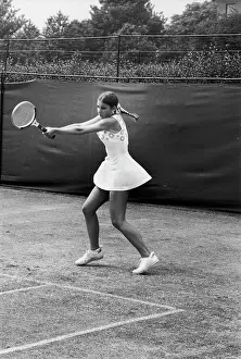 Prints of American tennis player Chris Evert swings her racquet during a match against Australian Evonne Goolagong during the Championship at Wimbledon, London, England, June 1973 The Grand Slam Gallery: Evert Plays At Wimbledon