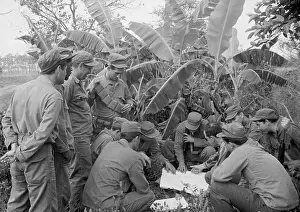 Exile Prints: Exiled Anti-Castro Cubans Studying Map