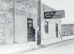 Oakland Prints: Exterior View of Man Standing at Doorway of Cantina Establishment