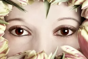 Images Dated 14th March 2010: Eyes of a woman framed by tulips