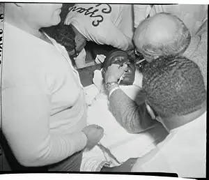 Ezzard Charles Being Checked for Boxing Injury