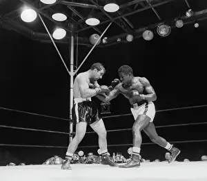 Ezzard Charles Hits Rocky Marciano Chest