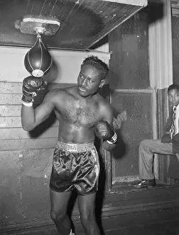 Gymnasium Prints: Ezzard Charles Punching Bag