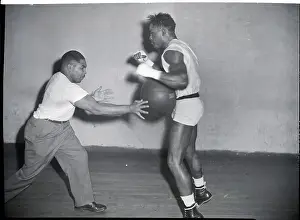 Gymnasium Prints: Ezzard Charles and Trainer with Medicine Ball