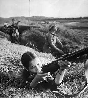 Factory Girl Holding Rifle