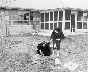 Family Emerging from Bomb Shelter