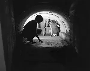 Shelter Prints: Family Escaping in a Tunnel