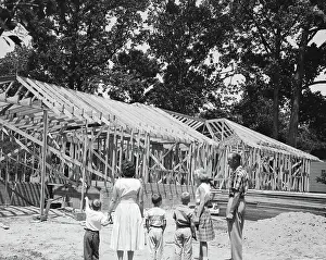 Building Construction Prints: Family Looking at House Frame