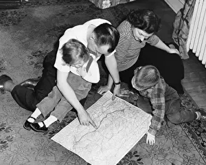 Two Parents Prints: Family looking at roadmap