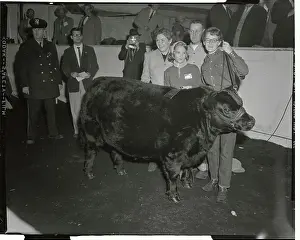 Family Members Posing with Their Prize Steer