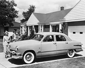Prosperity Prints: Family with New Ford Sedan in Driveway
