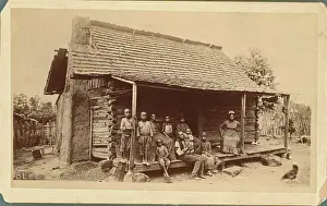 Family Posing Outside Cabin