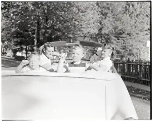 Family Seated in Convertible