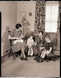 Family Sitting in Living Room
