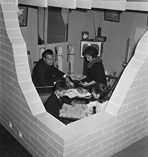 Shelter Prints: Family Sitting in Model Fallout Shelter