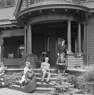 Teenage Girl Prints: Family Sitting on Porch of Victorian Style House