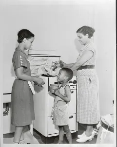 Harlem Prints: Family Unpacking in Kitchen