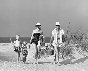 Two Parents Prints: Family walking on beach, carrying fishing poles and portable cooler