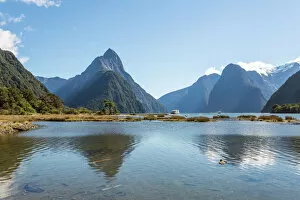 Mountain Peak Gallery: Famous Milford Sound in a sunny day with blue sky, New Zealand