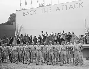 Prints of (Original Caption). A galaxy of Hollywood stars attended the preview of the Treasury's Back The Attack Show Behind the Laughter: Lucille Ball's Unseen Moments: Famous Stars Waving Behind Military Presentation