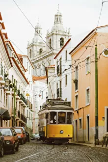 Cable Car Collection: Famous yellow tram on the narrow streets of Alfama district, Lisbon, Portugal