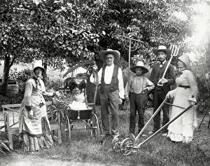 Farm Family Poses With Farming Implement