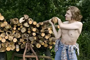 Atop Prints: Farmer lifting a log