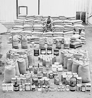 Pail Prints: Farmer Surveys Chemical Supply