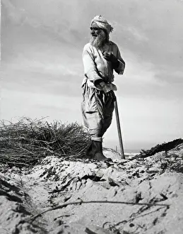 Farmer Works Arid Israeli Soil