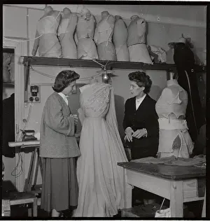 Fashion Designer and Assistant Discussing Dress