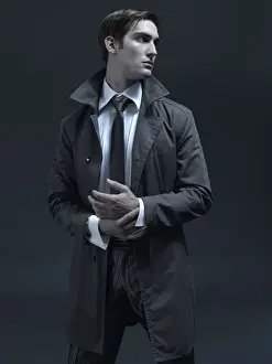 Thoughtful Prints: Fashion shot of a man in a suit and jacket