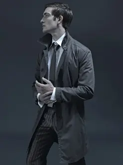 Thoughtful Prints: Fashion shot of a man in a suit and jacket