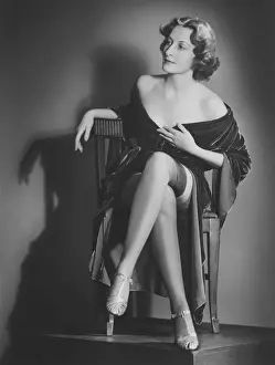 Human Legs Prints: Fashionable woman posing in studio, showing legs, (B&W), portrait