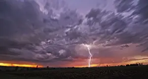 Awesome Prints: A Fast Moving African Thunderstorm with a Forked Lightning Strike at Sunset