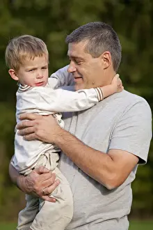 Father Prints: Father carrying his young son in his arms