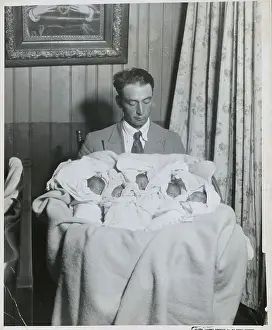 Fatherhood Prints: The Father is Holding Quintuplets