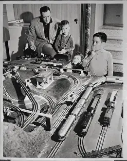 Father and Sons with Model Train Set