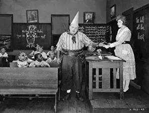 Classroom Prints: Fatty Arbuckle Getting Hand Slapped in Out West