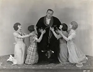 Fatty Arbuckle Surrounded By Women