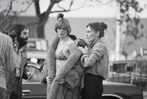 Faye Dunaway Assisting Model with Fur Coat