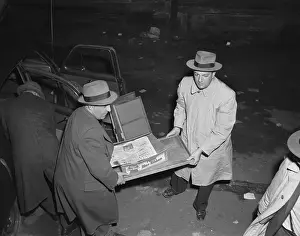 FBI Agents Carrying a Box of Money
