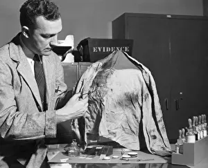 Cloth Prints: FBI Lab Technician Cuts Fabric Sample