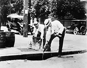 Crouching Prints: Federal Agents Pour Whiskey Into Sewer