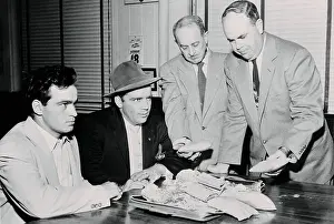 Memphis Prints: Federal Agents Standing over Drug Smuggling Suspects