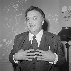 Federico Fellini with Hands on his Vest