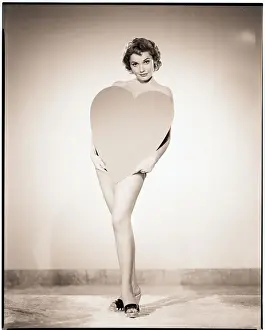 Valentines Day Prints: Felicia Farr Standing Behind Heart