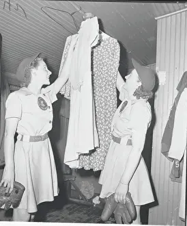 Female Baseball Players Hanging Dresses