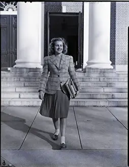 Female College Student Carrying Books