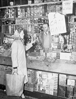 Decisive Prints: Female Customer Chatting with Clerk Regarding Product
